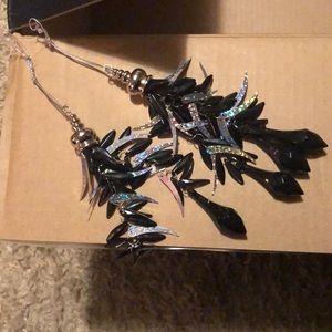 Beautiful, black hard plastic with shiny bling pieces. ornaments or lamp decor.